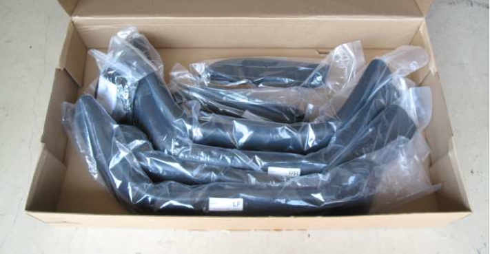 Fender flares in their plastic shipping sleeves