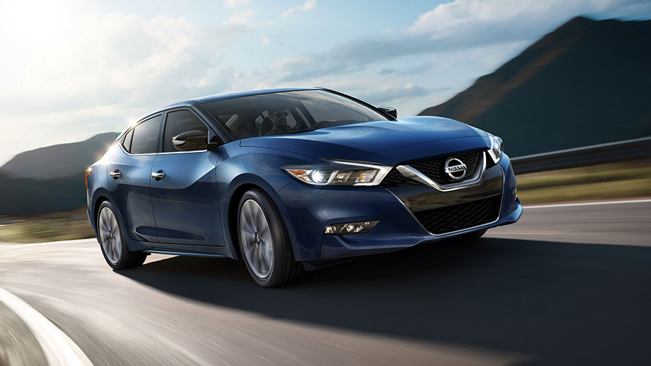 2016-nissan-maxima-deep-blue-pearl-highway-driving-front-side-view